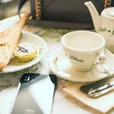 Breakfast at Cafe de Flore related to Charming Stays in the City of Lights
