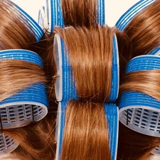 brown and blue hair brush related to Mastering the Art of the Bed Head Curler: Unleash Effortless Waves