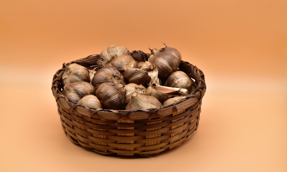 brown and white garlic on brown woven basket related to Understanding Tanning Bed Bulbs: Price Breakdown and Buying Guide