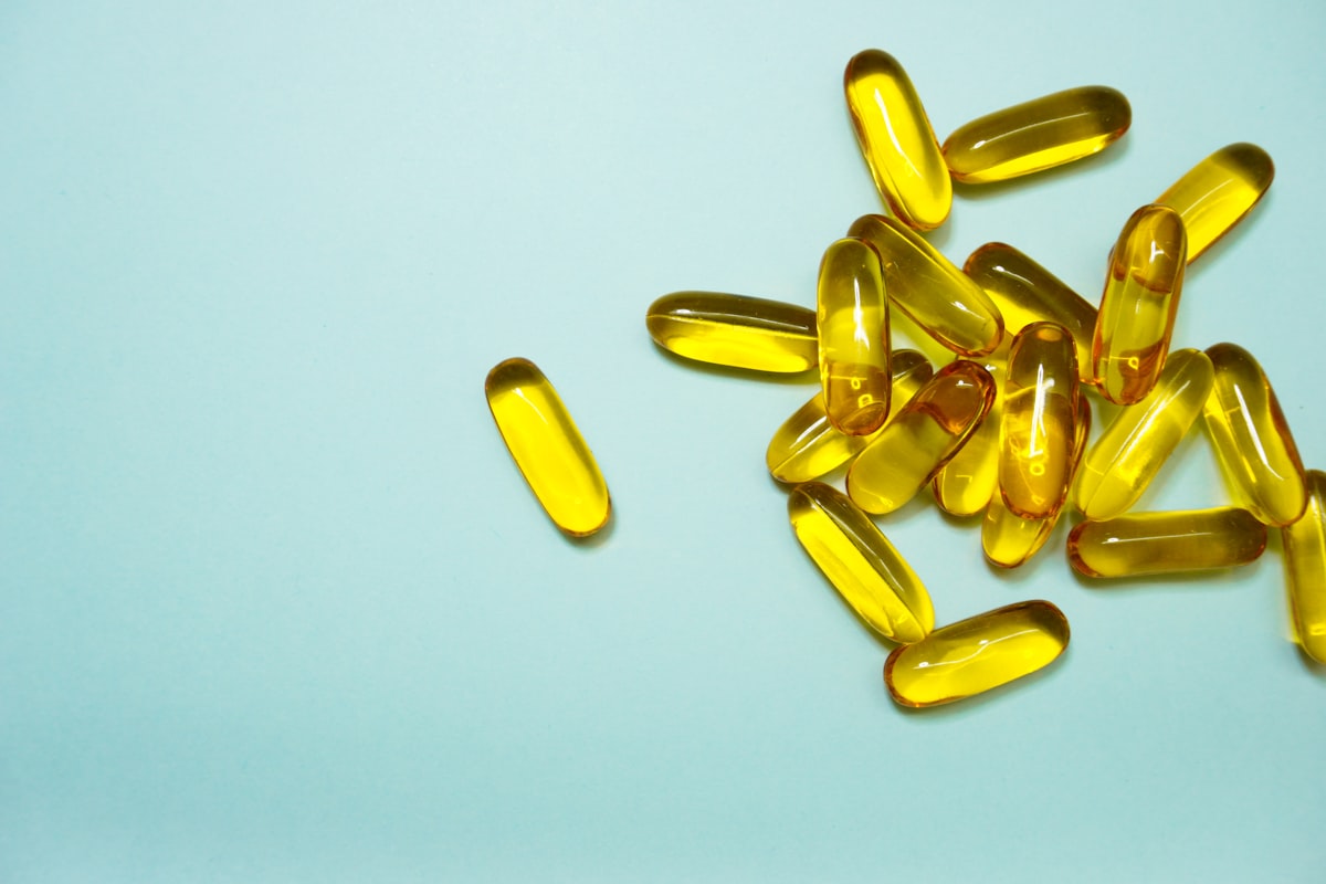 brown and yellow medication tablets related to Exploring the Benefits and Risks of Vitamin D Tanning Beds