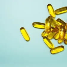 brown and yellow medication tablets related to Exploring the Benefits and Risks of Vitamin D Tanning Beds