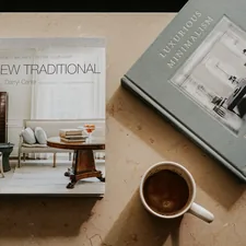 brown ceramic mug near two books related to Transforming Spaces: The Ultimate Guide to Amazon Kids Beds