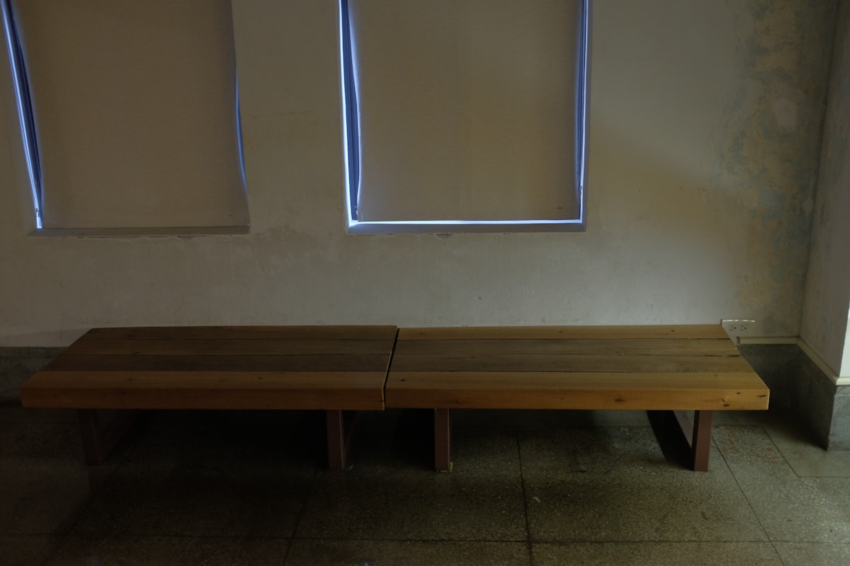 brown wooden bench beside white wall related to The Ultimate Wooden Entryway Bench: Elevate Your Home's First Impression