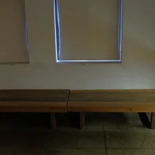 brown wooden bench beside white wall related to The Ultimate Wooden Entryway Bench: Elevate Your Home's First Impression