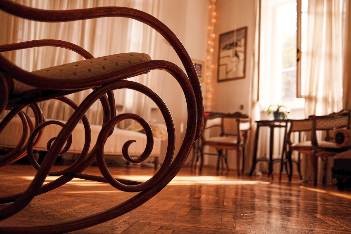 brown wooden chair on brown wooden floor related to Elegant and Timeless Mahogany Sleigh Bed Designs