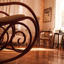 brown wooden chair on brown wooden floor related to Elegant and Timeless Mahogany Sleigh Bed Designs
