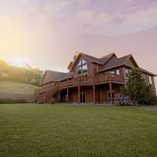 brown wooden house with green grass field related to Transforming Your Dream Home with Bed Bath & Beyond Registry