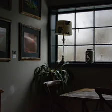 brown wooden table with chairs related to Elevating Your Windows: The Art of Choosing the Perfect Valance