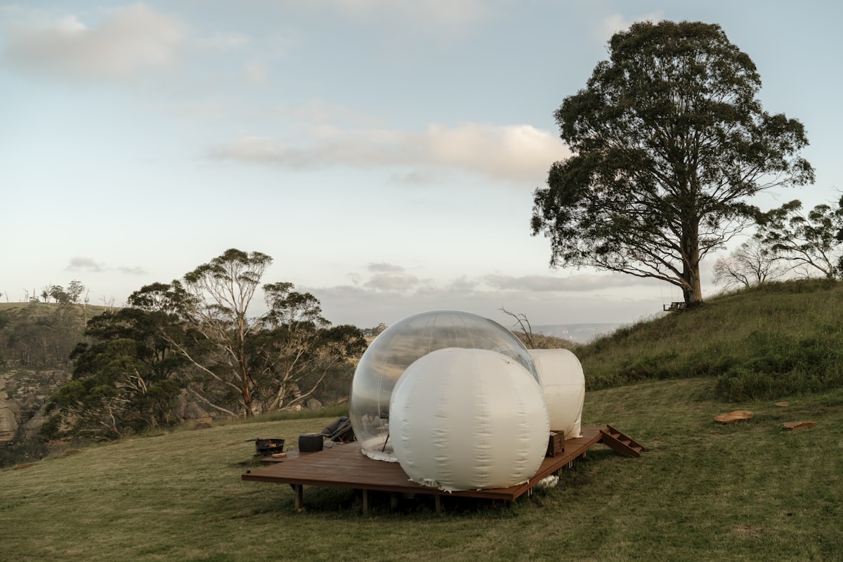 Bubble tent set on a farm overlooking Capertee Valley. related to The Bubble Baby Bed: Revolutionizing Infant Sleep Solutions