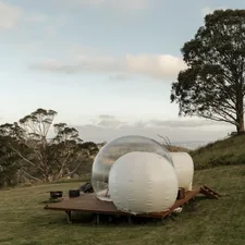 Bubble tent set on a farm overlooking Capertee Valley. related to The Bubble Baby Bed: Revolutionizing Infant Sleep Solutions
