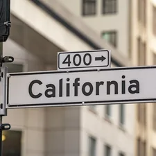 California street sign with building in background related to Understanding California King Bed Dimensions