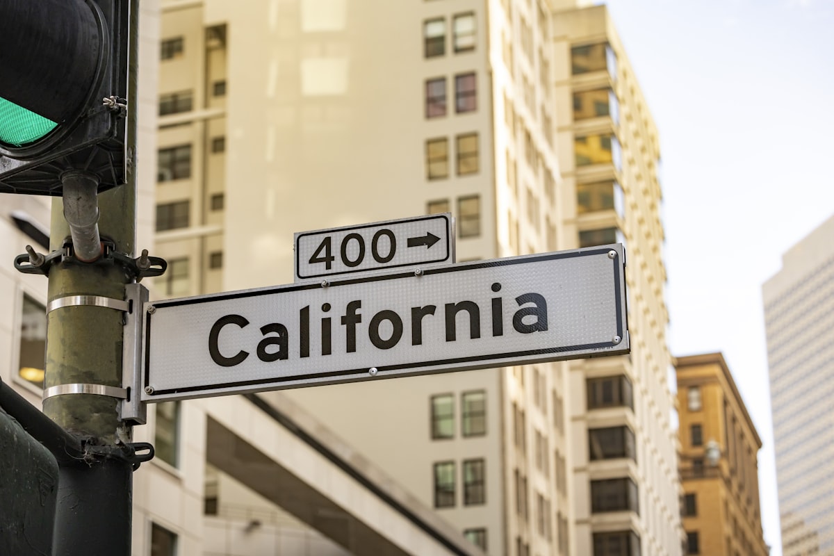 California street sign with buildings in background related to Understanding California King Bed Dimensions