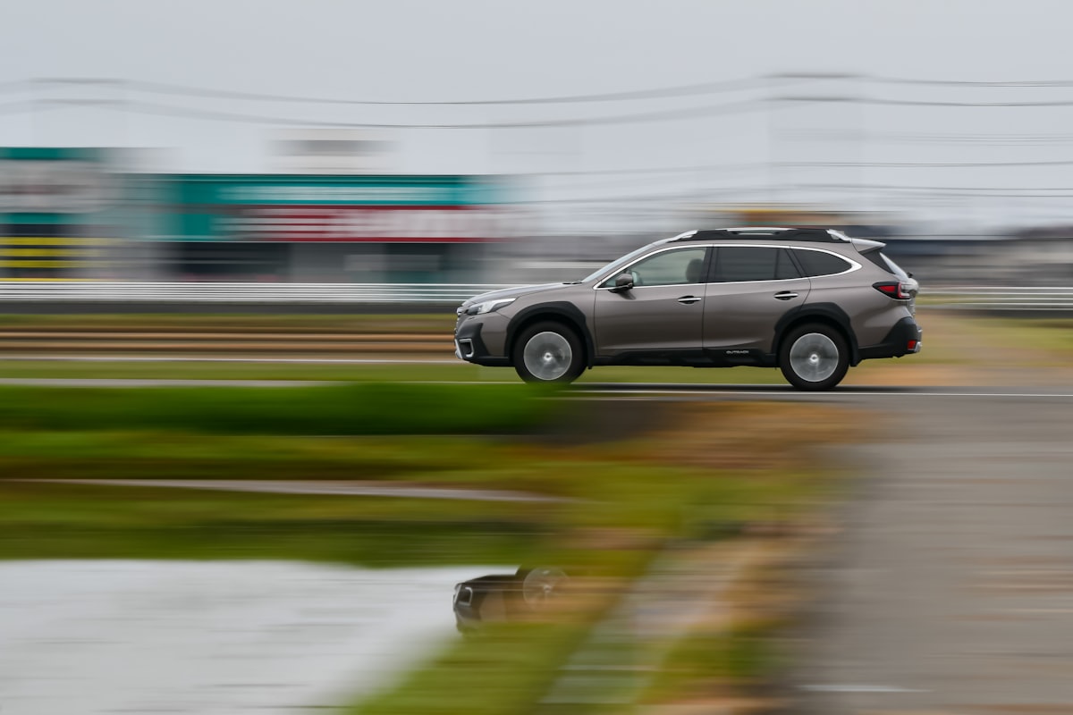 Car driving on the road. related to Exploring the Versatility of Subaru with a Truck Bed