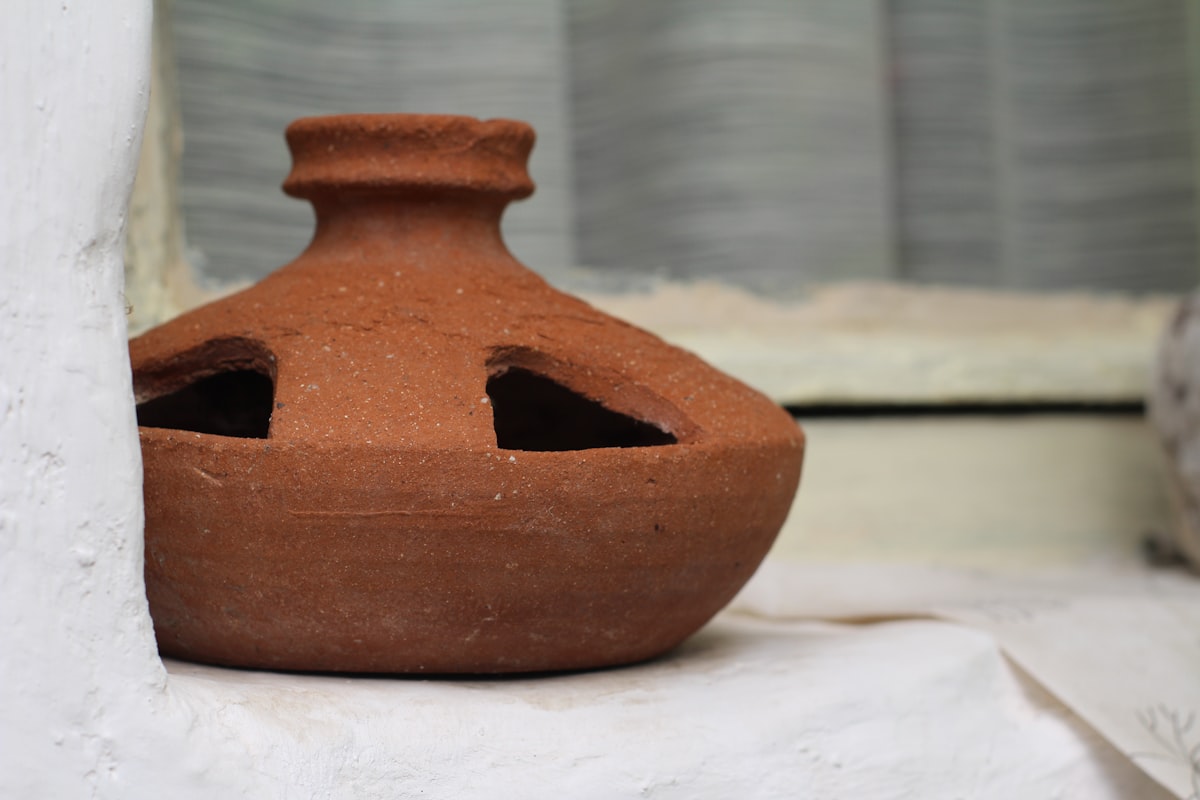 Clay chicken drinking bowl. related to The Ultimate Guide to Large Clay Chimineas
