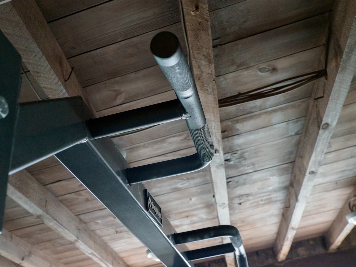 close up, bokeh, macro, blur, blurred background, close focus, weight training, gym, weights, gym equipment, working out, home gym, exercise, garage gym, body building, progressive weight training,
 related to Elevating Safety: The Importance of Bunk Bed Ladder Hooks