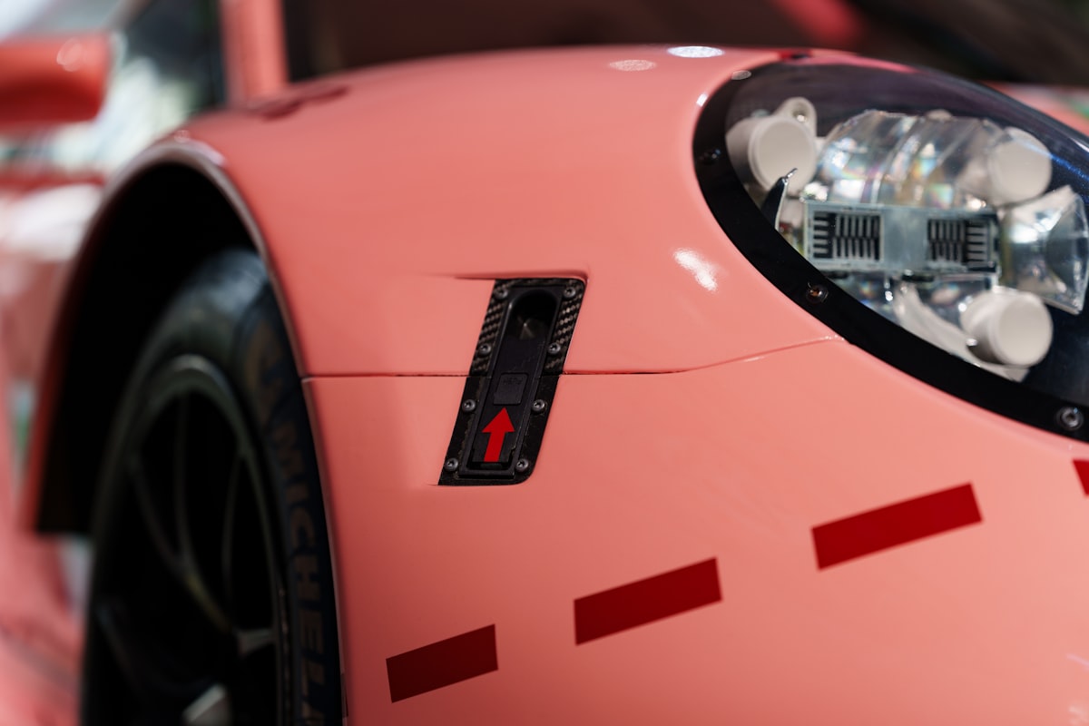 Close up of a pink race car related to Transform Your Kid's Room with a Pink Corvette Bed