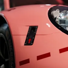 Close up of a pink race car related to Transform Your Kid's Room with a Pink Corvette Bed