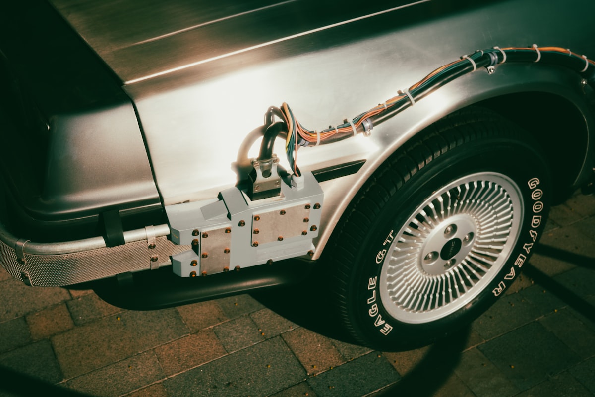Close-up of a silver car's rear wheel and side panel related to Choosing the Right Hitch for Short Bed Trucks