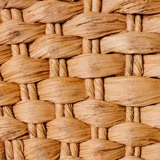 Close-up of a woven natural fiber basket texture. related to The Ultimate Guide to Wicker Dog Beds