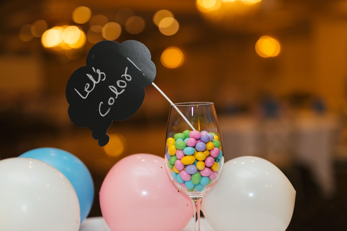 colorful candy in a wine glass related to Add a Pop of Color to Your Space with a Hot Pink Valance