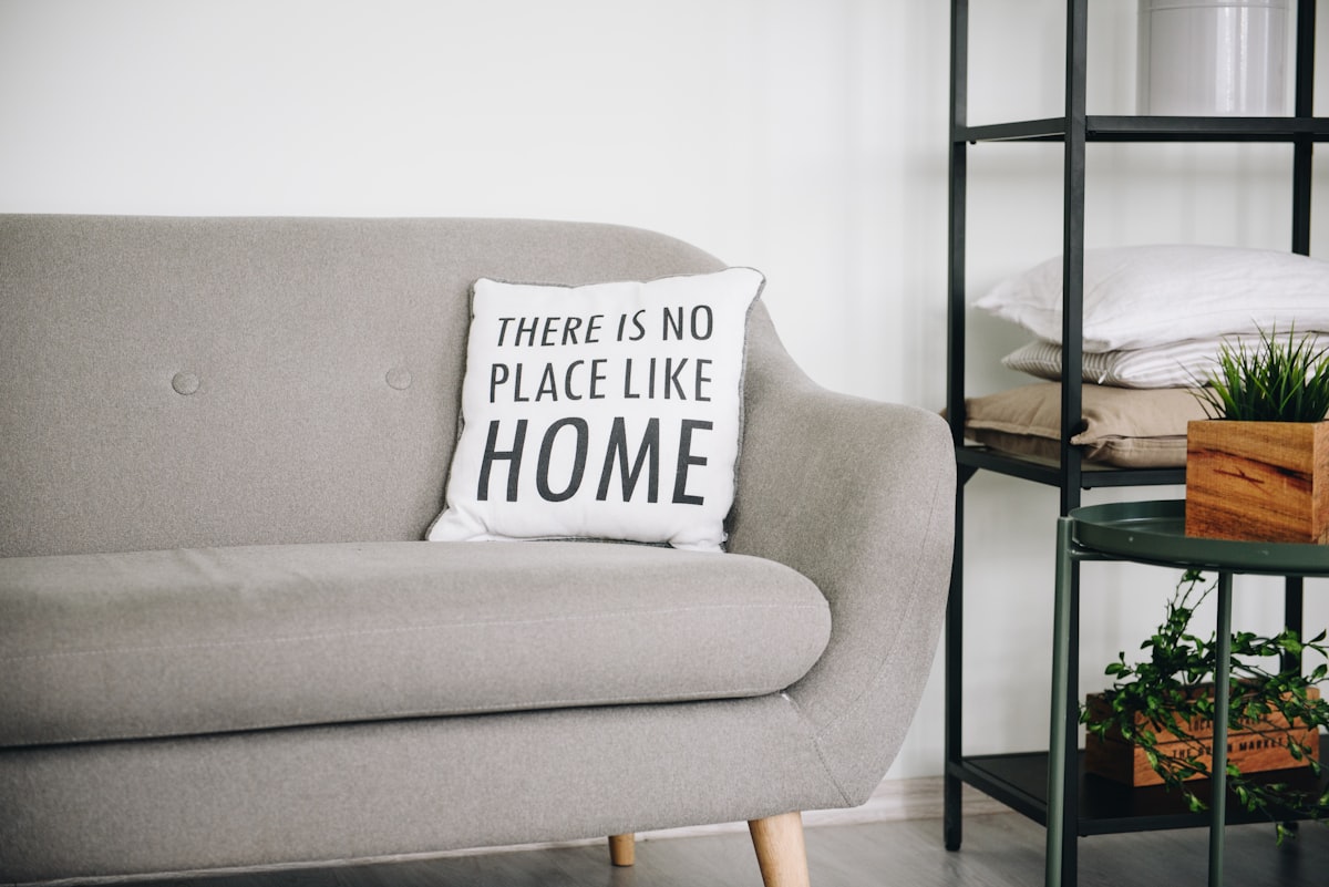 Cozy and comfy sofa at home, nicely decorated room related to Elevate Your Home Decor with Burlap Valance Curtains