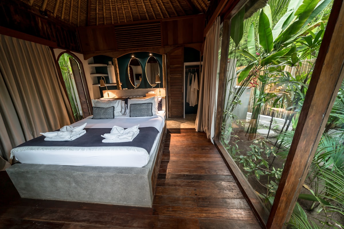 Cozy bedroom with large window overlooking lush greenery related to Transform Your Bedroom with an Elegant Asian Style Bed