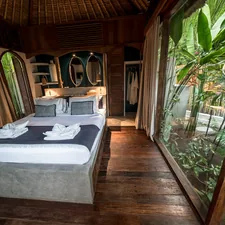 Cozy bedroom with large window overlooking lush greenery related to Transform Your Bedroom with an Elegant Asian Style Bed