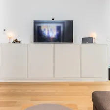 Custom made sideboard with an integrated TV. Made by the carpenters of Pickawood. related to The Ultimate Guide to Elevating Your Space with a Sideboard Buffet Table