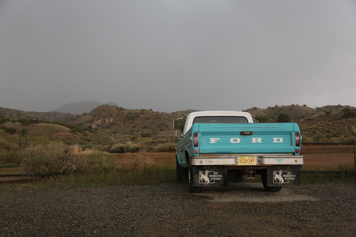 Desert landscape with vintage ford pick up truck related to Maximizing Space: The Benefits of a Long Bed for Your Truck