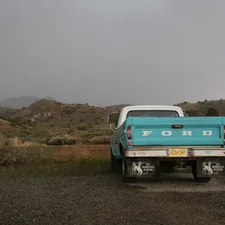 Desert landscape with vintage ford pick up truck related to Maximizing Space: The Benefits of a Long Bed for Your Truck