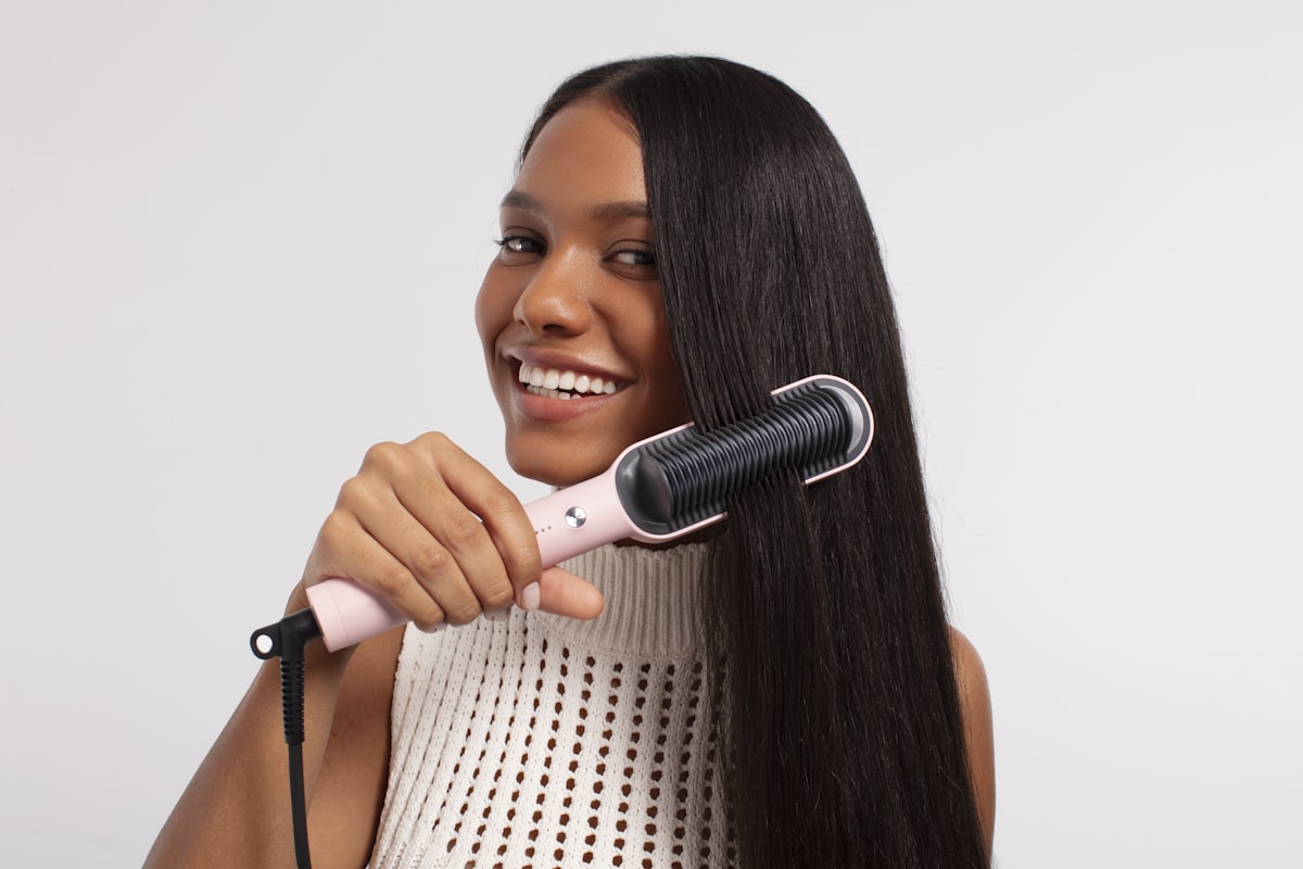 Effortless styling with TYMO's hair straightening brush, designed for achieving silky-smooth hair with ease and precision. related to Taming the Tangles with the Bed Head Curling Wand: Ultimate Guide