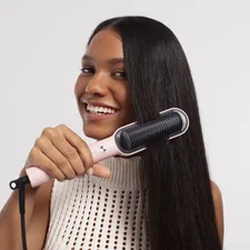 Effortless styling with TYMO's hair straightening brush, designed for achieving silky-smooth hair with ease and precision. related to Taming the Tangles with the Bed Head Curling Wand: Ultimate Guide