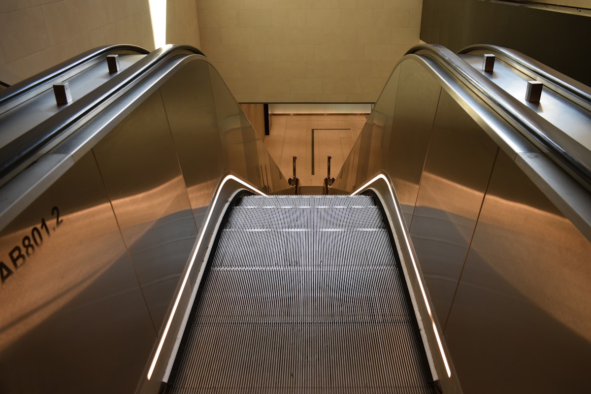 Empty escalator related to Elevate Your Space: The Ultimate Guide to Lift Bed Frames