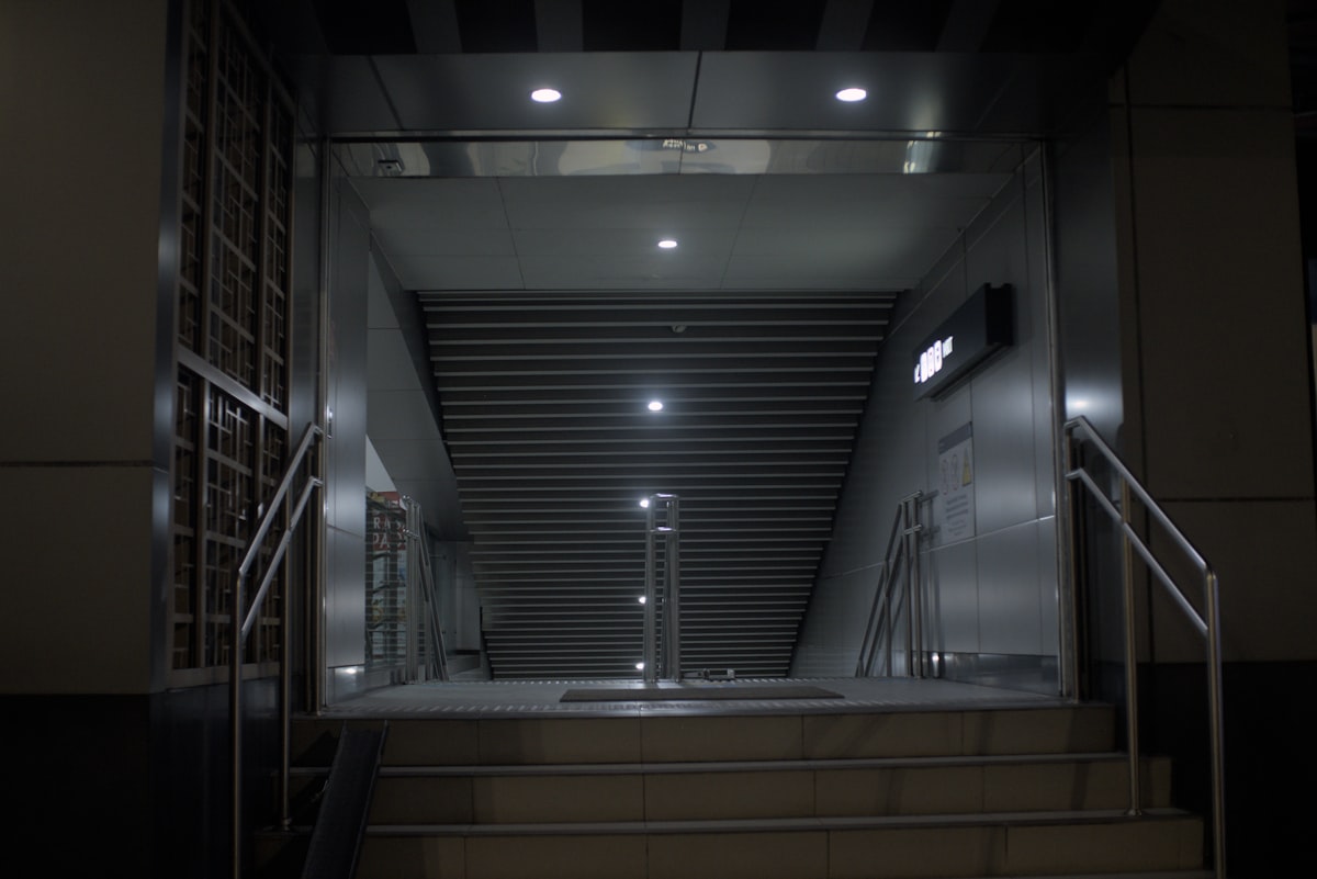 Empty industrial elevator shaft with lights related to The Ultimate Guide to the Bed Bug Registry