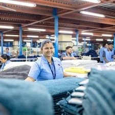 Factory workers are busy in a textile factory. related to Discover Empowering Opportunities at Bed Bath & Beyond