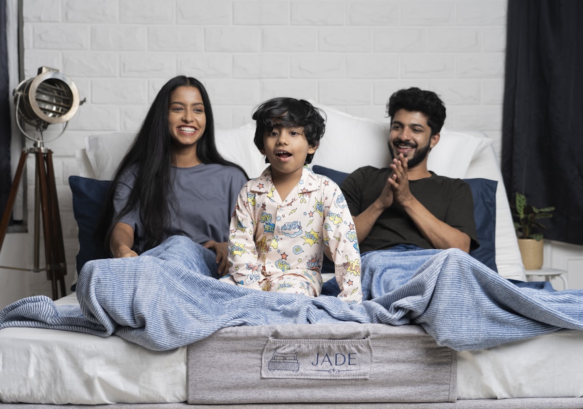 Family on an adjustable bed related to Elevate Your Sleep Sanctuary: The Underrated Power of Elasticated Bed Valances