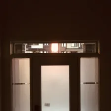 Front door at sunrise. Interior angles and shadows. related to Enhancing Your Home's First Impression with Entryway Doors with Sidelights