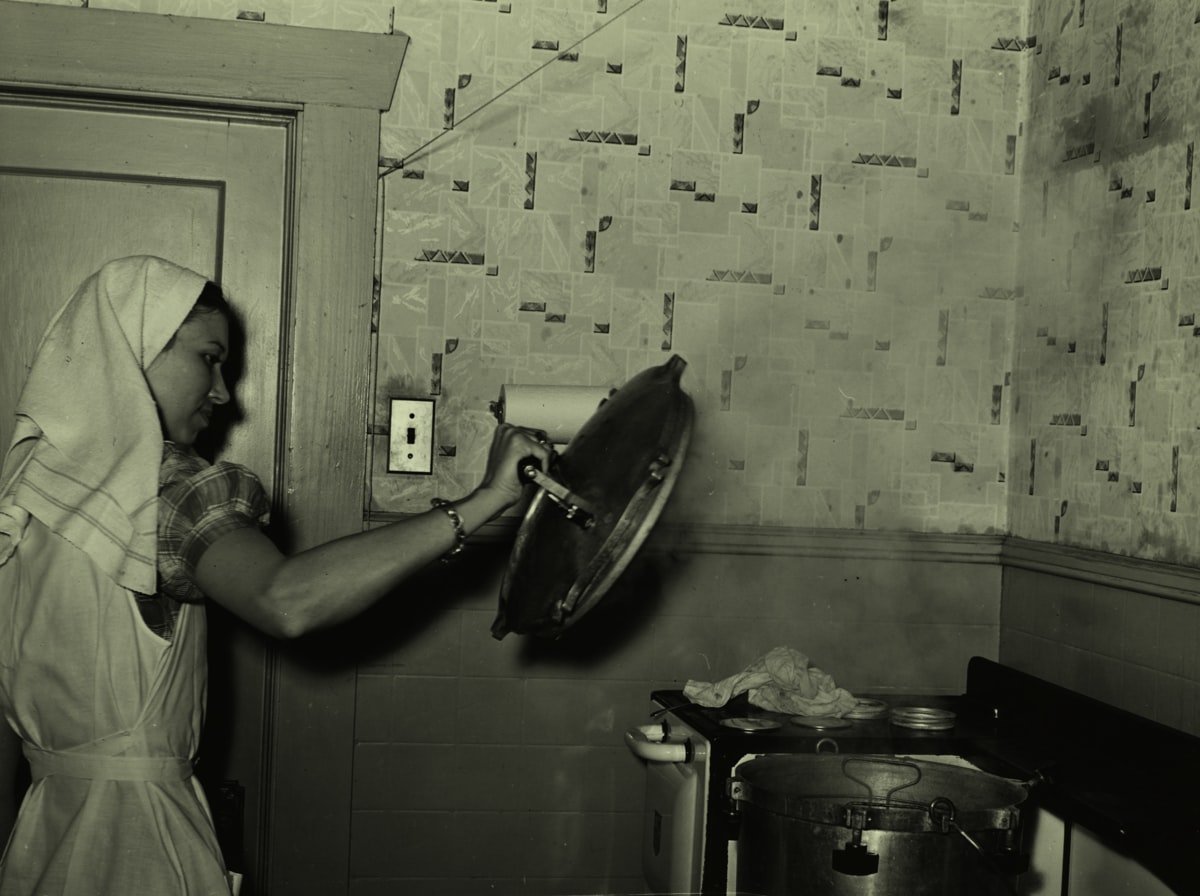 FSA (Farm Security Administration) supervisor giving a demonstration of pressure canning before a group of FSA officials at a district meeting at San Angelo, Texas. She is removing top of pressure cooker. 1940 related to The Ultimate Food Steamer for Your Kitchen: A Bed Bath & Beyond Guide