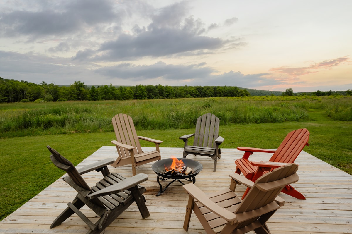 Gather around the fire (IG: @clay.banks) related to Cozy Up Outdoors: The Ultimate Guide to Large Chiminea Outdoor Fireplaces