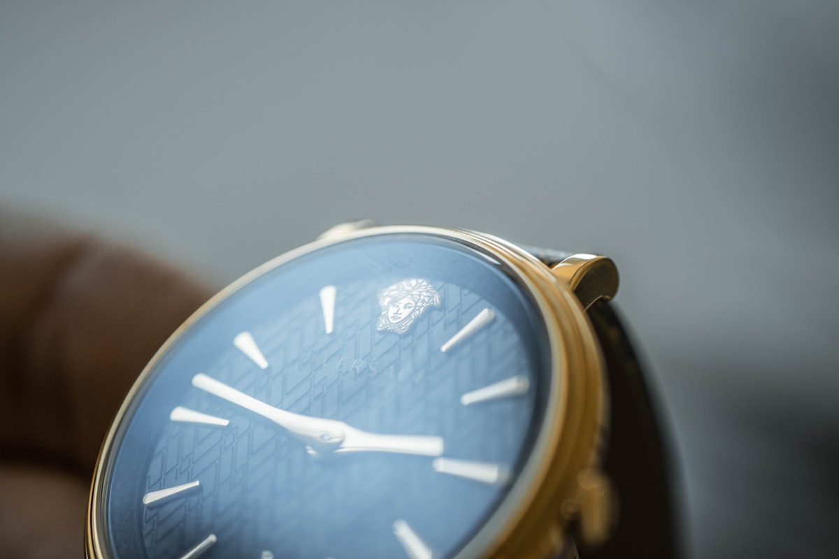 gold and silver analog watch related to Luxurious Comfort: Exploring Versace Bedding Sets