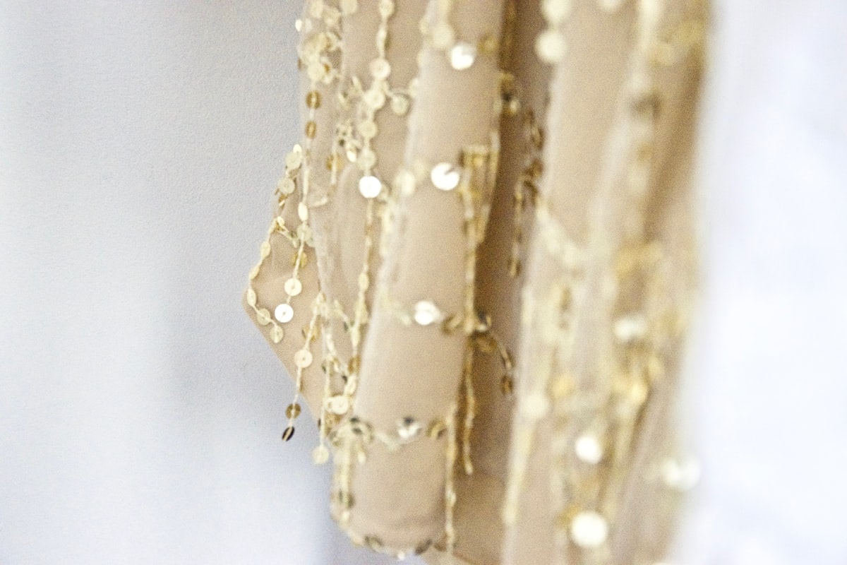 gold and white floral textile related to Elegance Unveiled: Gold Valances for Windows