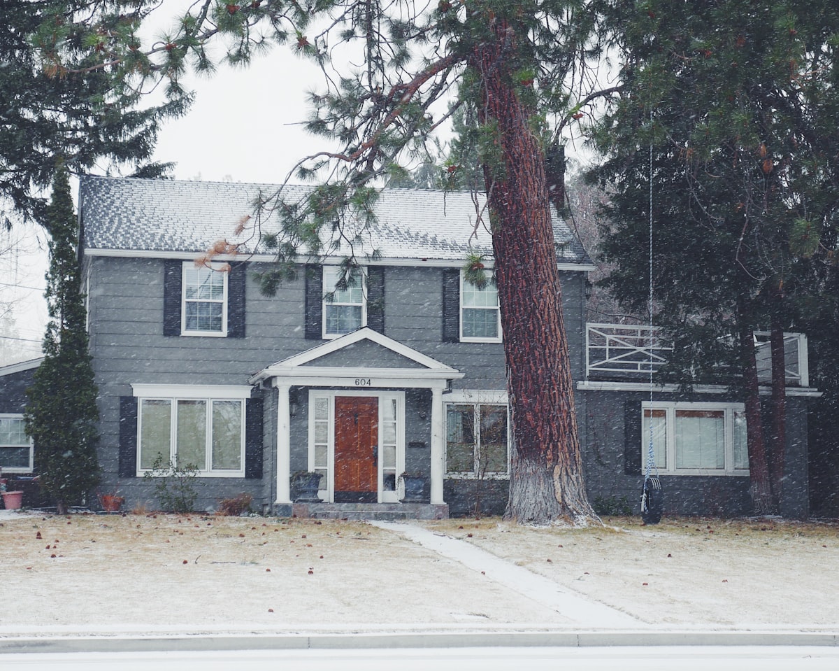 gray and white wooden house near green leaf tree related to Charming Stays in Bend, Oregon
