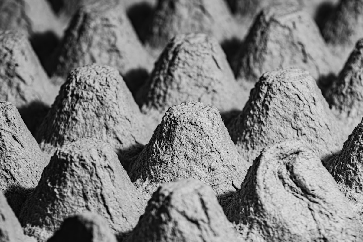gray scale photo of rock formation related to Understanding Bed Egg Crate Foam and Its Benefits