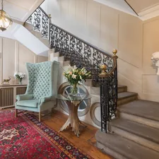 gray wing chair near strais related to Elegant Entryways: Incorporating an Antique Entryway Bench