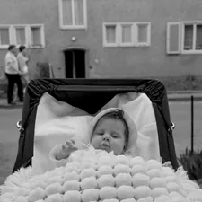 grayscale photo of baby in stroller related to Baby on the Move: The Ultimate Guide to Eddie Bauer Infant Travel Bed