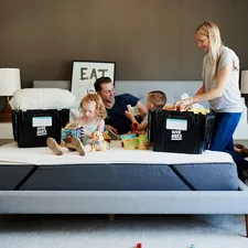 group of people sitting on white couch related to The Ultimate Guide to Bed in a Box