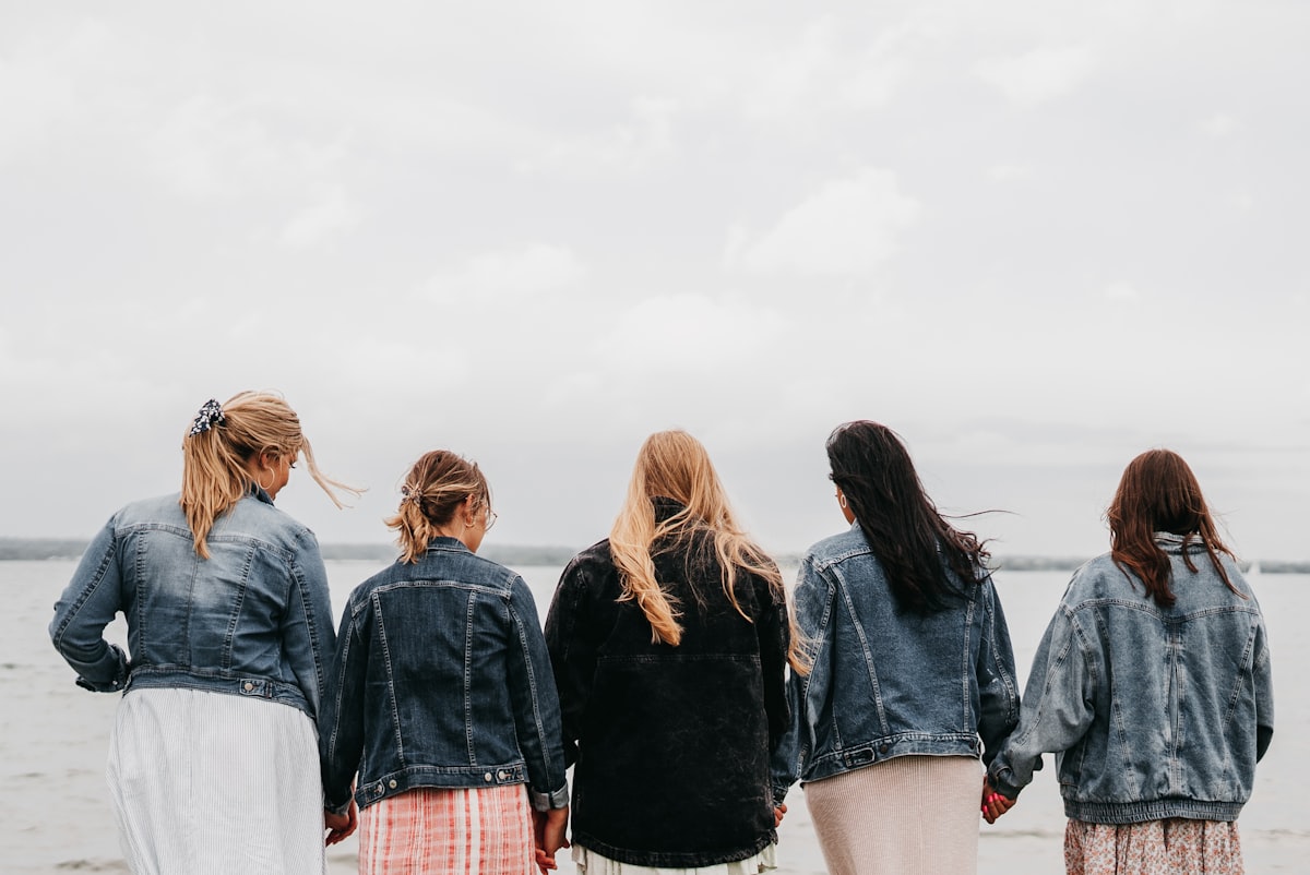 group of people standing on gray concrete floor during daytime related to The Ultimate Guide to Pretty Bed Sheets