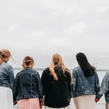 group of people standing on gray concrete floor during daytime related to The Ultimate Guide to Pretty Bed Sheets