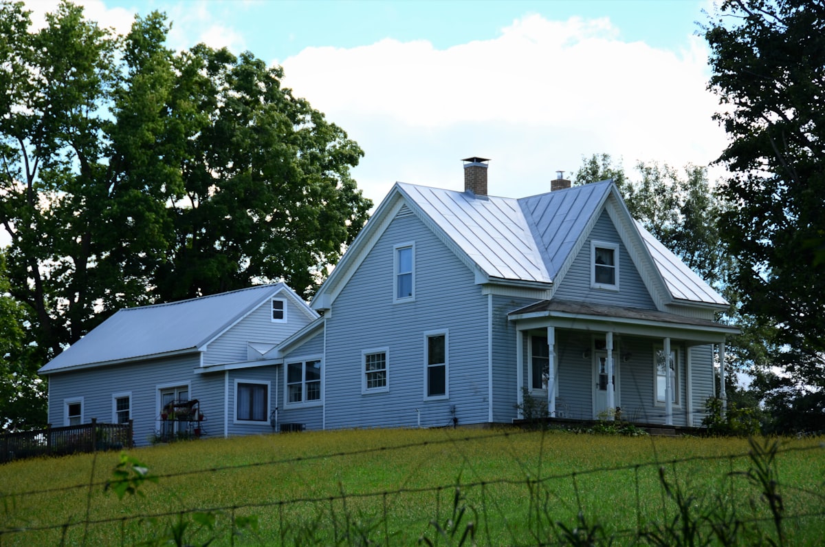 Historic gray and white 2 story farmhouse with multiple additions related to Discover the Charm of Blue Ridge Bed and Breakfast: A Serene Escape