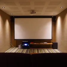 Home theater with a screen and comfortable seating. related to Ultimate Movie Night: Choosing the Perfect Movie Room Couch Bed